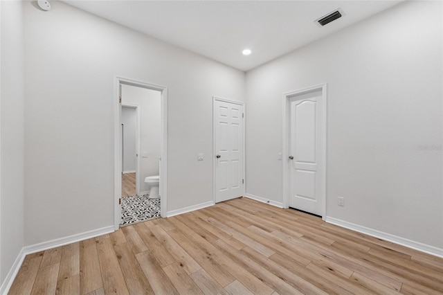9402 Woodbay Dr, Tampa, FL 33626 - empty room with light wood-type flooring, baseboards, and recessed lighting