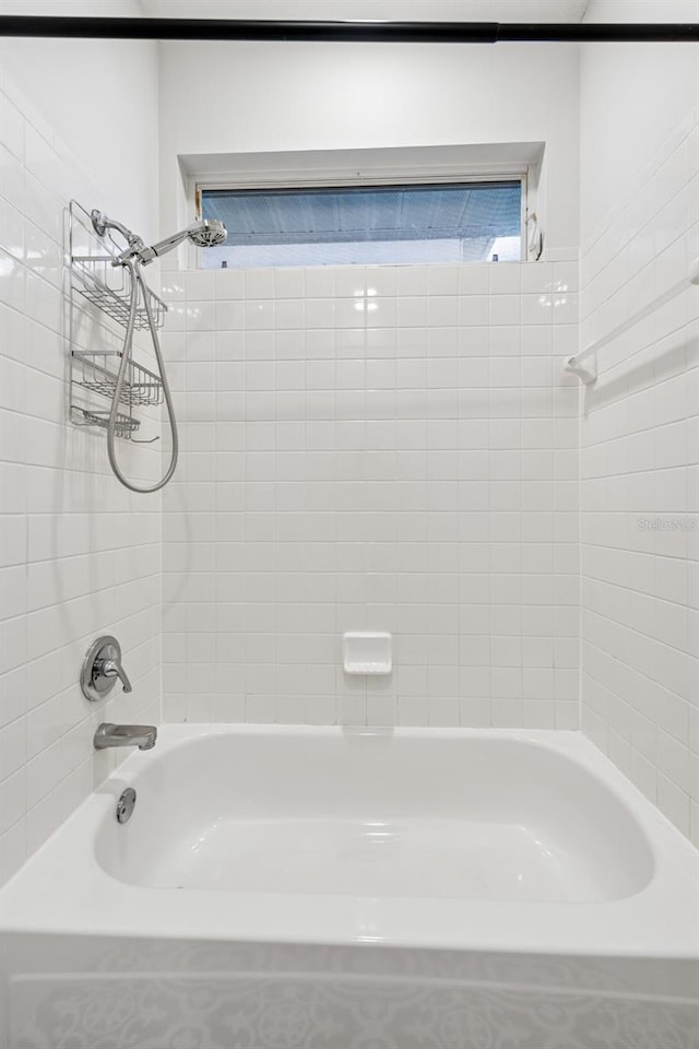 9402 Woodbay Dr, Tampa, FL 33626 - bathroom featuring shower / washtub combination
