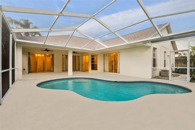 9402 Woodbay Dr, Tampa, FL 33626 - swimming pool featuring a patio, ceiling fan, and a lanai