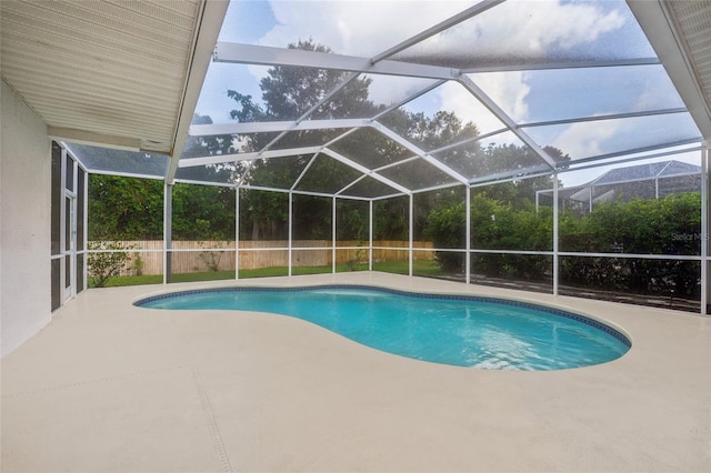 9402 Woodbay Dr, Tampa, FL 33626 - outdoor pool featuring a patio area and glass enclosure