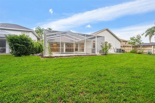 9402 Woodbay Dr, Tampa, FL 33626 - back of house with a patio and glass enclosure