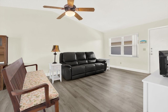 3146 37th Ln S Unit A, Saint Petersburg, FL 33711 - living area with a ceiling fan, light wood-style floors, vaulted ceiling, and baseboards