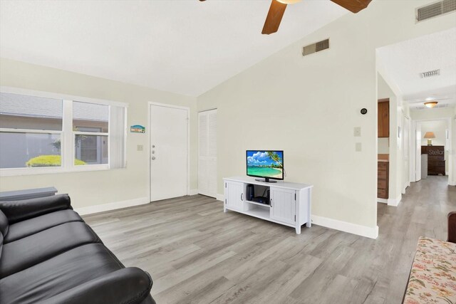 3146 37th Ln S Unit A, Saint Petersburg, FL 33711 - living area featuring a ceiling fan, light wood-style flooring, vaulted ceiling, and baseboards
