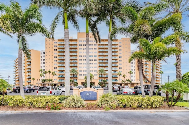 880 Mandalay Ave Unit C1103, Clearwater Beach, FL 33767 - view of apartment building / complex with uncovered parking