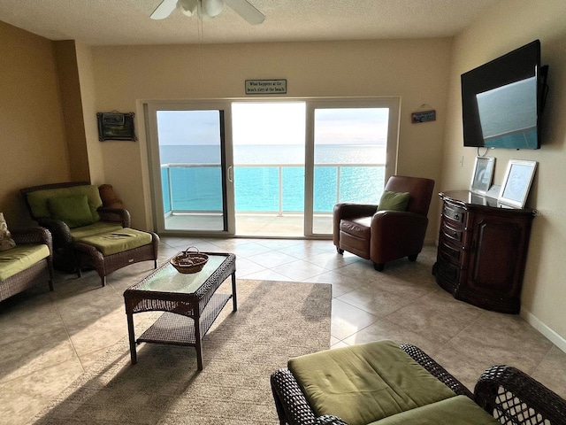 880 Mandalay Ave Unit C1103, Clearwater Beach, FL 33767 - living room with ceiling fan, light tile patterned floors, and a textured ceiling