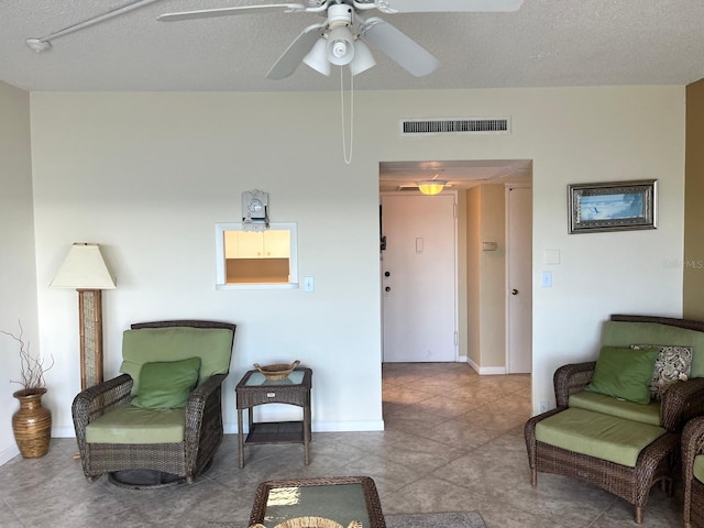 880 Mandalay Ave Unit C1103, Clearwater Beach, FL 33767 - sitting room with a ceiling fan, baseboards, and a textured ceiling