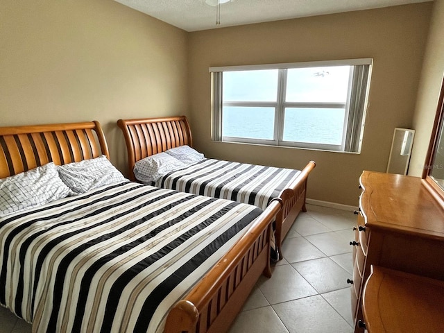 880 Mandalay Ave Unit C1103, Clearwater Beach, FL 33767 - bedroom with light tile patterned flooring and baseboards