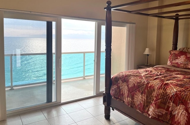 880 Mandalay Ave Unit C1103, Clearwater Beach, FL 33767 - bedroom featuring light tile patterned floors and a water view