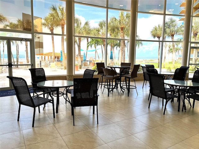 880 Mandalay Ave Unit C1103, Clearwater Beach, FL 33767 - dining area with plenty of natural light and tile patterned flooring