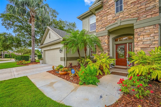 3000 Naughton Way, Tarpon Springs, FL 34688 - property entrance with stone siding, stucco siding, driveway, and an attached garage