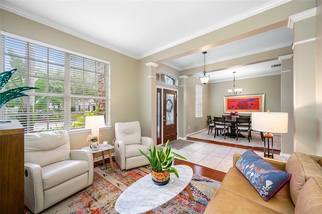 3000 Naughton Way, Tarpon Springs, FL 34688 - living room featuring crown molding, wood finished floors, baseboards, and a chandelier