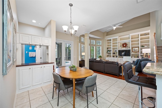 3000 Naughton Way, Tarpon Springs, FL 34688 - dining space featuring light tile patterned floors, built in shelves, a ceiling fan, ornate columns, and vaulted ceiling