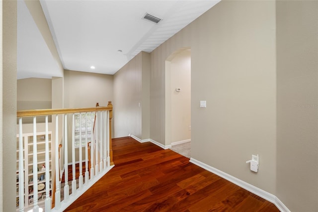 3000 Naughton Way, Tarpon Springs, FL 34688 - corridor with arched walkways, wood finished floors, and baseboards