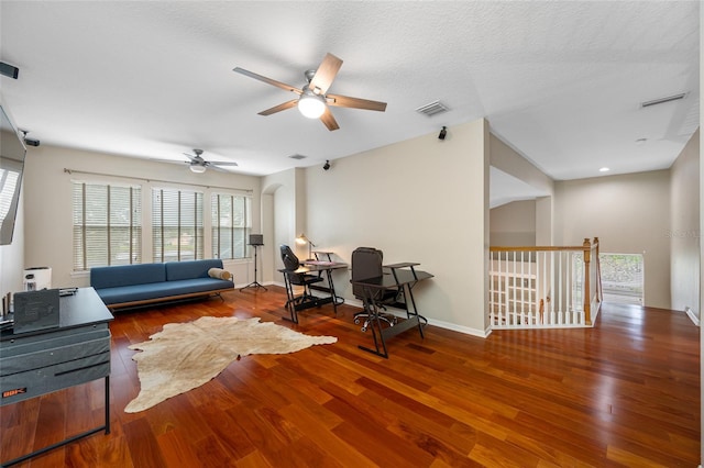 3000 Naughton Way, Tarpon Springs, FL 34688 - living area with ceiling fan, a desk, wood finished floors, and baseboards