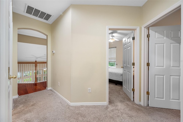 3000 Naughton Way, Tarpon Springs, FL 34688 - corridor with carpet floors, arched walkways, and baseboards