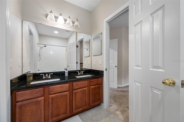 3000 Naughton Way, Tarpon Springs, FL 34688 - full bathroom with tiled shower, double vanity, tile patterned flooring, and baseboards