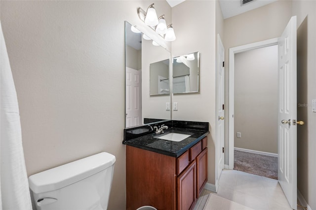 3000 Naughton Way, Tarpon Springs, FL 34688 - bathroom featuring vanity, toilet, tile patterned flooring, and baseboards