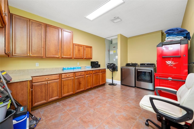 3000 Naughton Way, Tarpon Springs, FL 34688 - kitchen with separate washer and dryer, light countertops, and brown cabinets