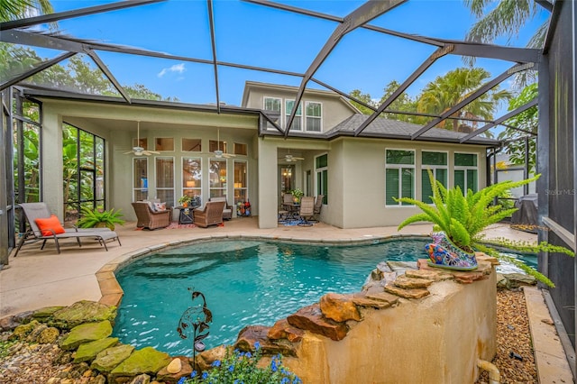 3000 Naughton Way, Tarpon Springs, FL 34688 - outdoor pool featuring a ceiling fan, a patio, glass enclosure, and an outdoor living space