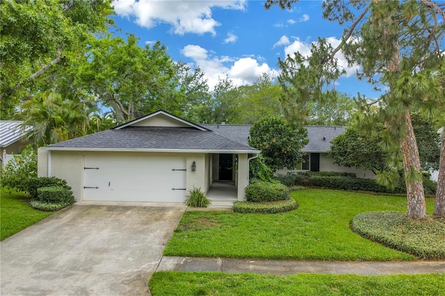 13898 Egret Ln, Clearwater, FL 33762 - ranch-style house with a front yard, a garage, a shingled roof, driveway, and brick siding