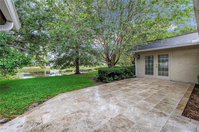 13898 Egret Ln, Clearwater, FL 33762 - view of patio featuring french doors and a water view