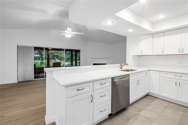 13898 Egret Ln, Clearwater, FL 33762 - kitchen featuring stainless steel dishwasher, ceiling fan, a sink, a peninsula, and lofted ceiling