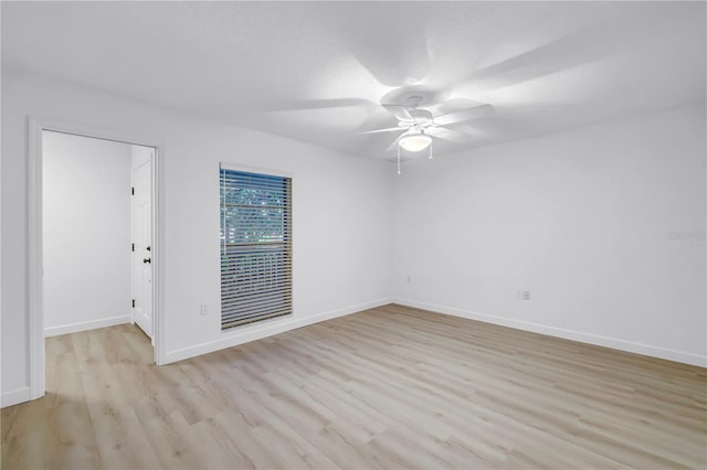 13898 Egret Ln, Clearwater, FL 33762 - unfurnished room featuring a ceiling fan, light wood-style floors, and baseboards