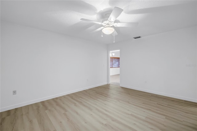 13898 Egret Ln, Clearwater, FL 33762 - empty room with light wood-type flooring, baseboards, and ceiling fan