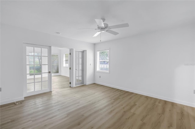 13898 Egret Ln, Clearwater, FL 33762 - empty room with light wood-type flooring, baseboards, and a ceiling fan