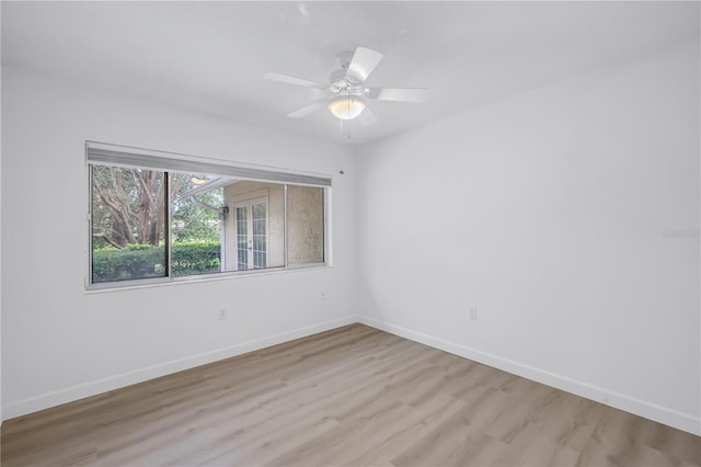 13898 Egret Ln, Clearwater, FL 33762 - spare room with light wood finished floors, baseboards, and ceiling fan