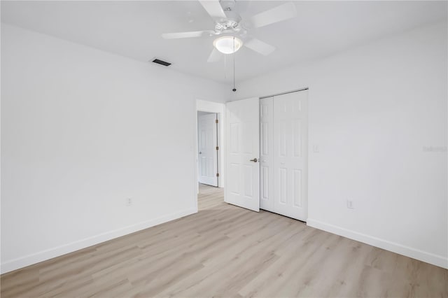13898 Egret Ln, Clearwater, FL 33762 - unfurnished room featuring baseboards, light wood-style floors, and a ceiling fan