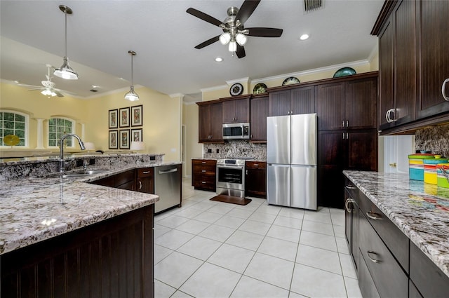 8444 Shenandoah Run, Wesley Chapel, FL 33544 - kitchen with appliances with stainless steel finishes, ceiling fan, a sink, decorative backsplash, and crown molding