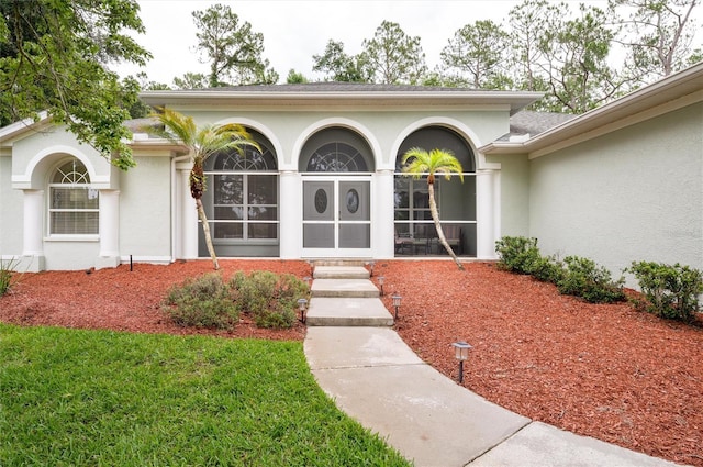 8444 Shenandoah Run, Wesley Chapel, FL 33544 - view of exterior entry with stucco siding