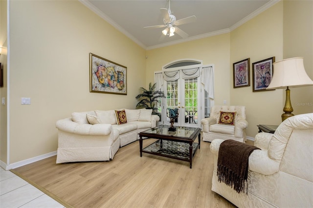 8444 Shenandoah Run, Wesley Chapel, FL 33544 - living area with crown molding, ceiling fan, baseboards, light wood-style flooring, and french doors