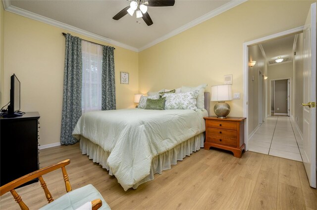 8444 Shenandoah Run, Wesley Chapel, FL 33544 - bedroom featuring ornamental molding, baseboards, light wood-style floors, and ceiling fan