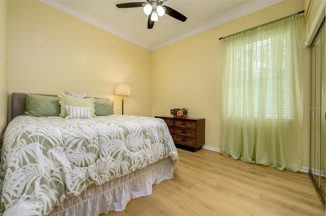 8444 Shenandoah Run, Wesley Chapel, FL 33544 - bedroom featuring ornamental molding, light wood finished floors, baseboards, and a ceiling fan