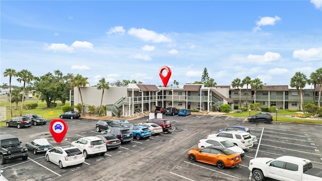 1028 Apollo Beach Blvd Unit 203, Apollo Beach, FL 33572 - uncovered parking lot with a residential view