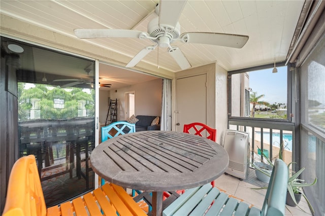 1028 Apollo Beach Blvd Unit 203, Apollo Beach, FL 33572 - sunroom / solarium with ceiling fan and outdoor dining space