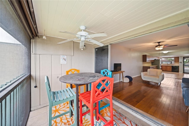 1028 Apollo Beach Blvd Unit 203, Apollo Beach, FL 33572 - dining room with ceiling fan and light wood-style floors