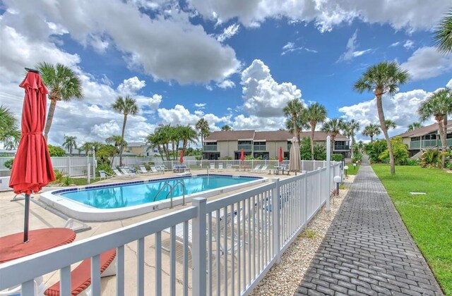 1028 Apollo Beach Blvd Unit 203, Apollo Beach, FL 33572 - community pool featuring a patio