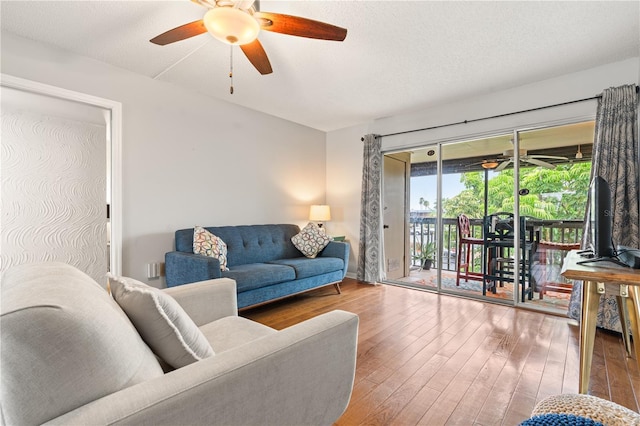 1028 Apollo Beach Blvd Unit 203, Apollo Beach, FL 33572 - living area featuring a ceiling fan and wood finished floors