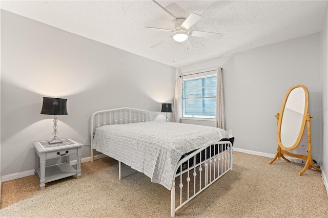 1028 Apollo Beach Blvd Unit 203, Apollo Beach, FL 33572 - bedroom featuring a textured ceiling, ceiling fan, and light colored carpet