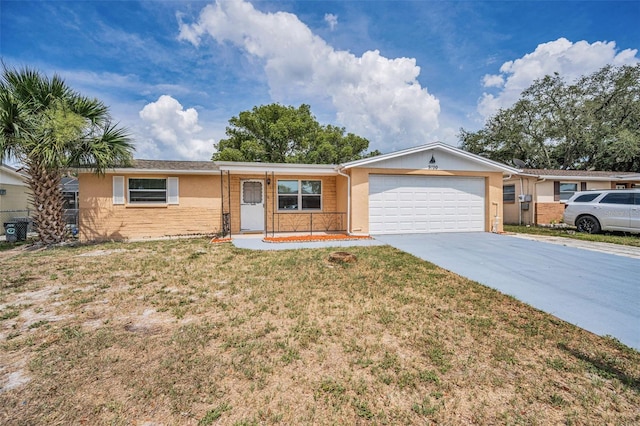 9100 Lunar Ln, Port Richey, FL 34668 - ranch-style home with stucco siding, an attached garage, driveway, and a front yard