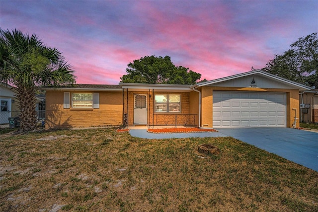 9100 Lunar Ln, Port Richey, FL 34668 - ranch-style house featuring an attached garage, driveway, stucco siding, and a porch