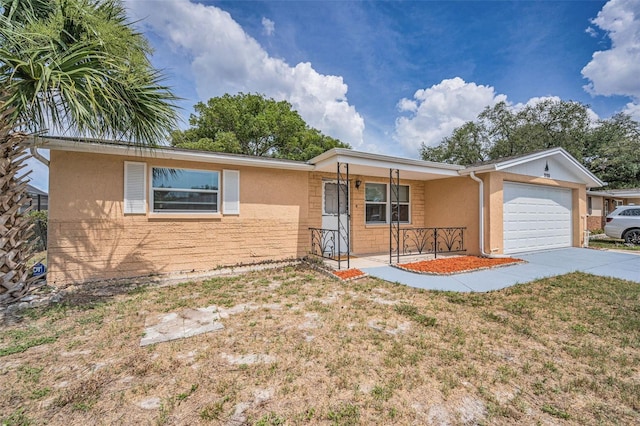 9100 Lunar Ln, Port Richey, FL 34668 - single story home with a garage, driveway, stucco siding, and a porch
