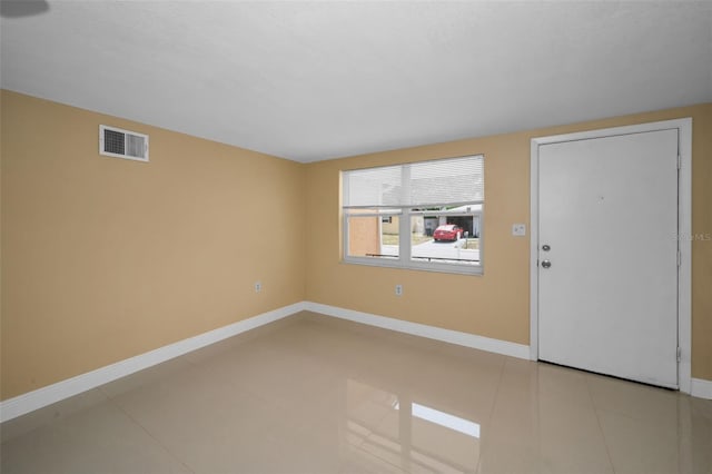 9100 Lunar Ln, Port Richey, FL 34668 - tiled foyer entrance featuring baseboards