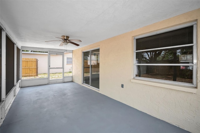 9100 Lunar Ln, Port Richey, FL 34668 - unfurnished sunroom with ceiling fan