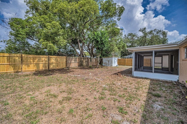 9100 Lunar Ln, Port Richey, FL 34668 - fenced backyard featuring a sunroom