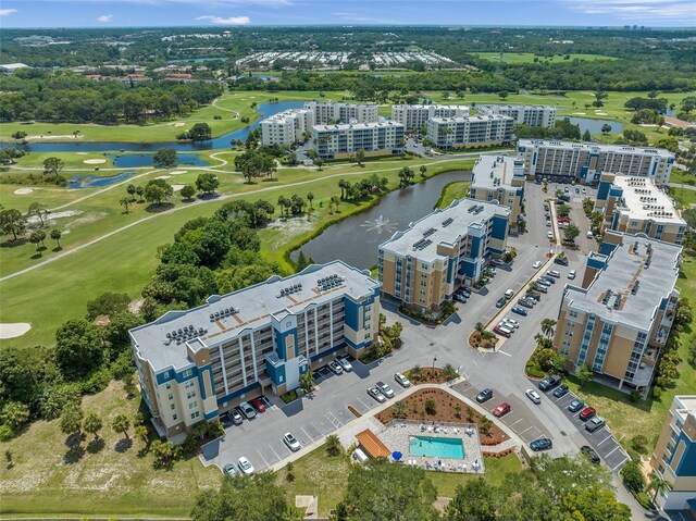 960 Starkey Rd Unit 9104, Largo, FL 33771 - drone / aerial view of apartment complex / building, a nearby body of water, and a golf course