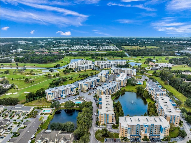 960 Starkey Rd Unit 9104, Largo, FL 33771 - drone / aerial view of apartment complex / building, a large body of water, and a golf club